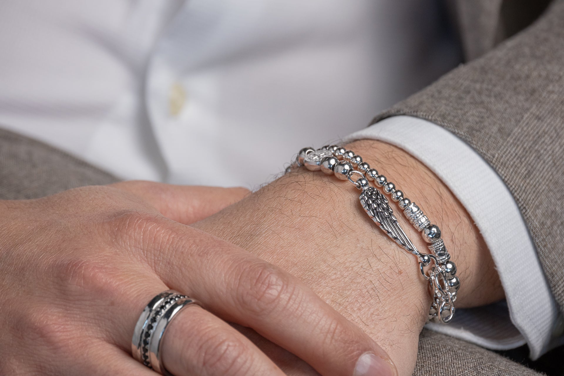 MEN'S TWO WOUNDS SILVER BRACELET SMALL AND LARGE BALLS WING CHARM